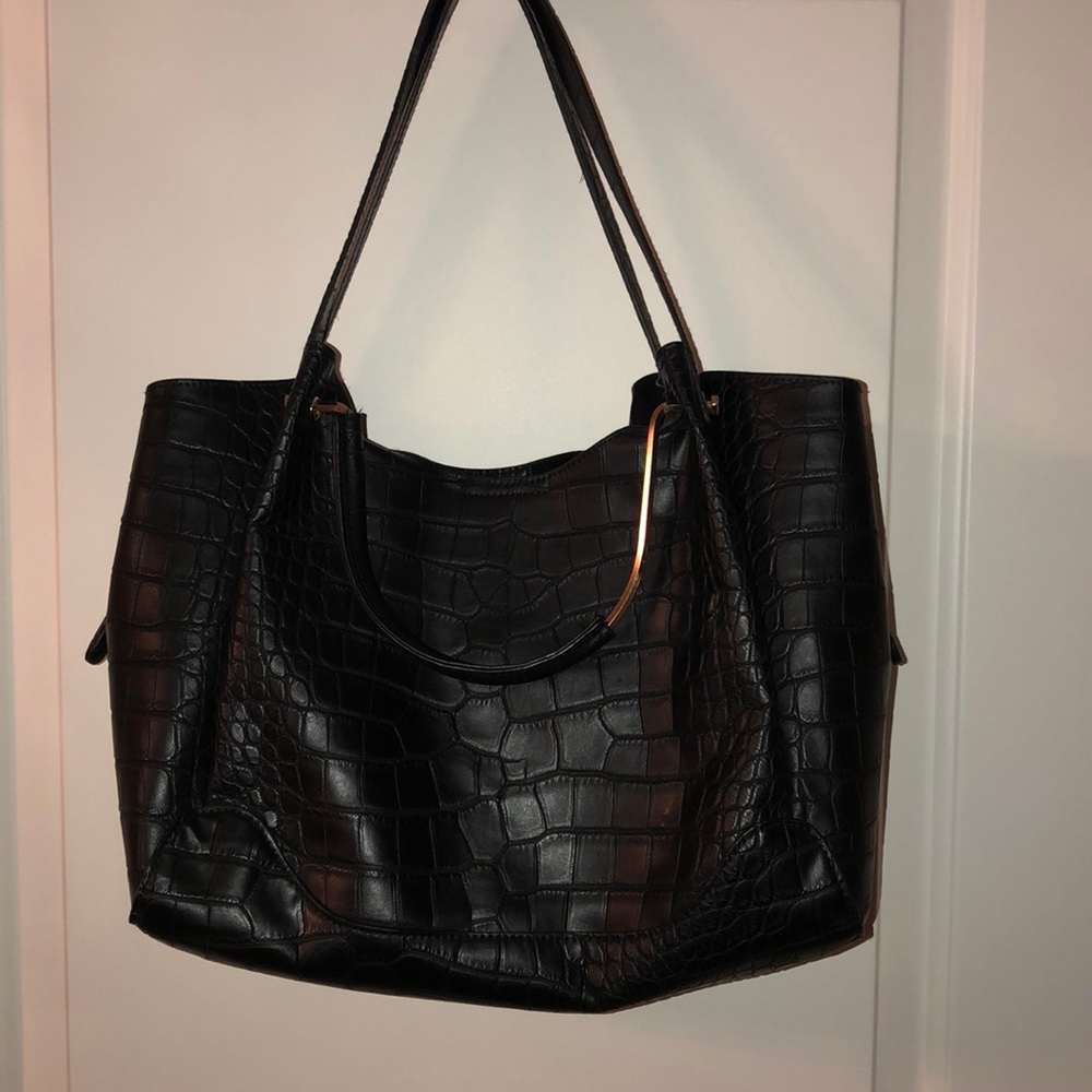 Women’s black crocodile purse
